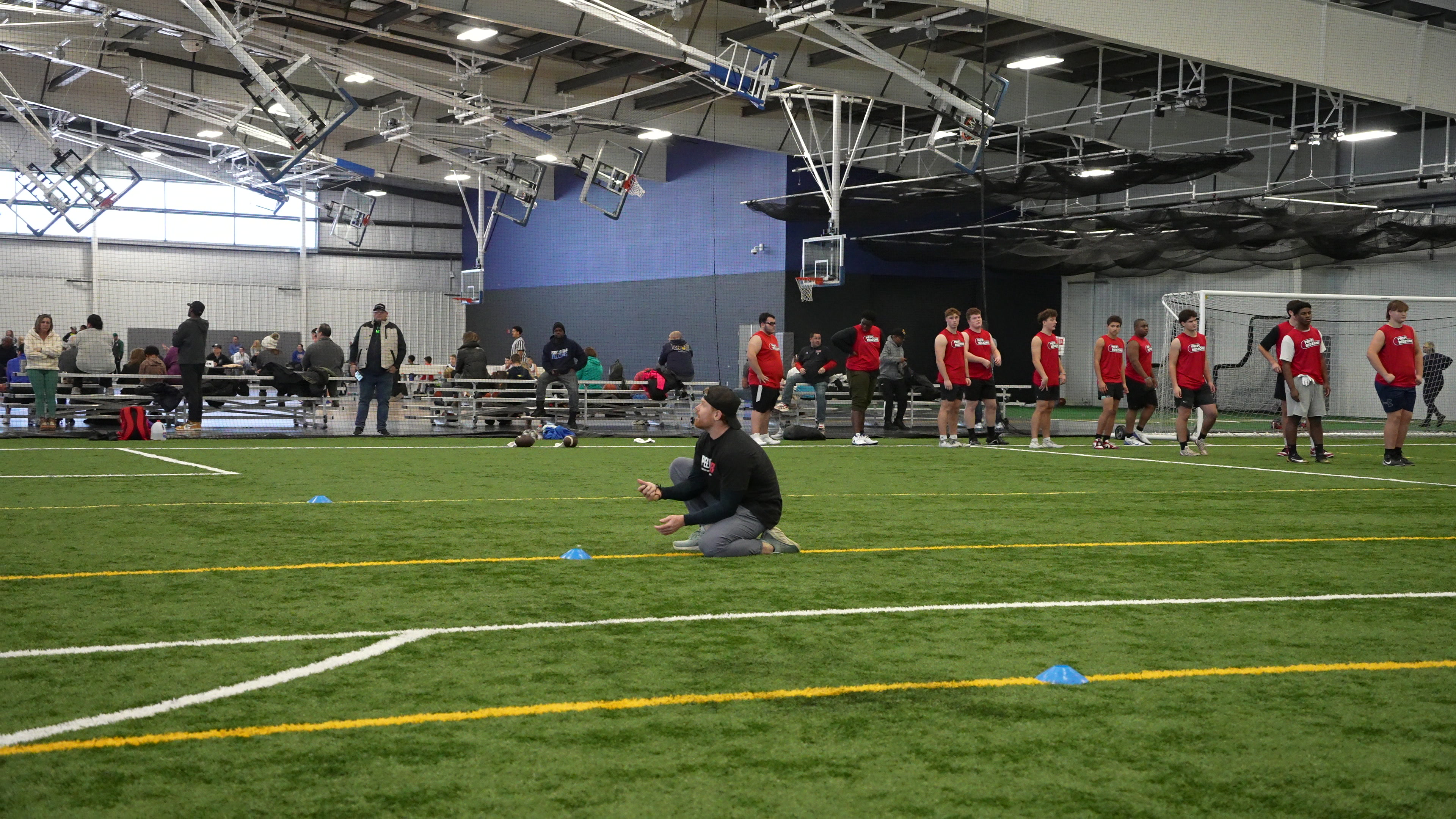 Full gym floor, athletes training in-season
